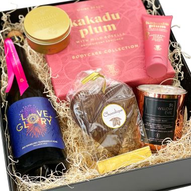 Gift pack of body creams, Belgian Chocolate, Love and Glory sparkling wine - low in sugar, and a candle with crystals
